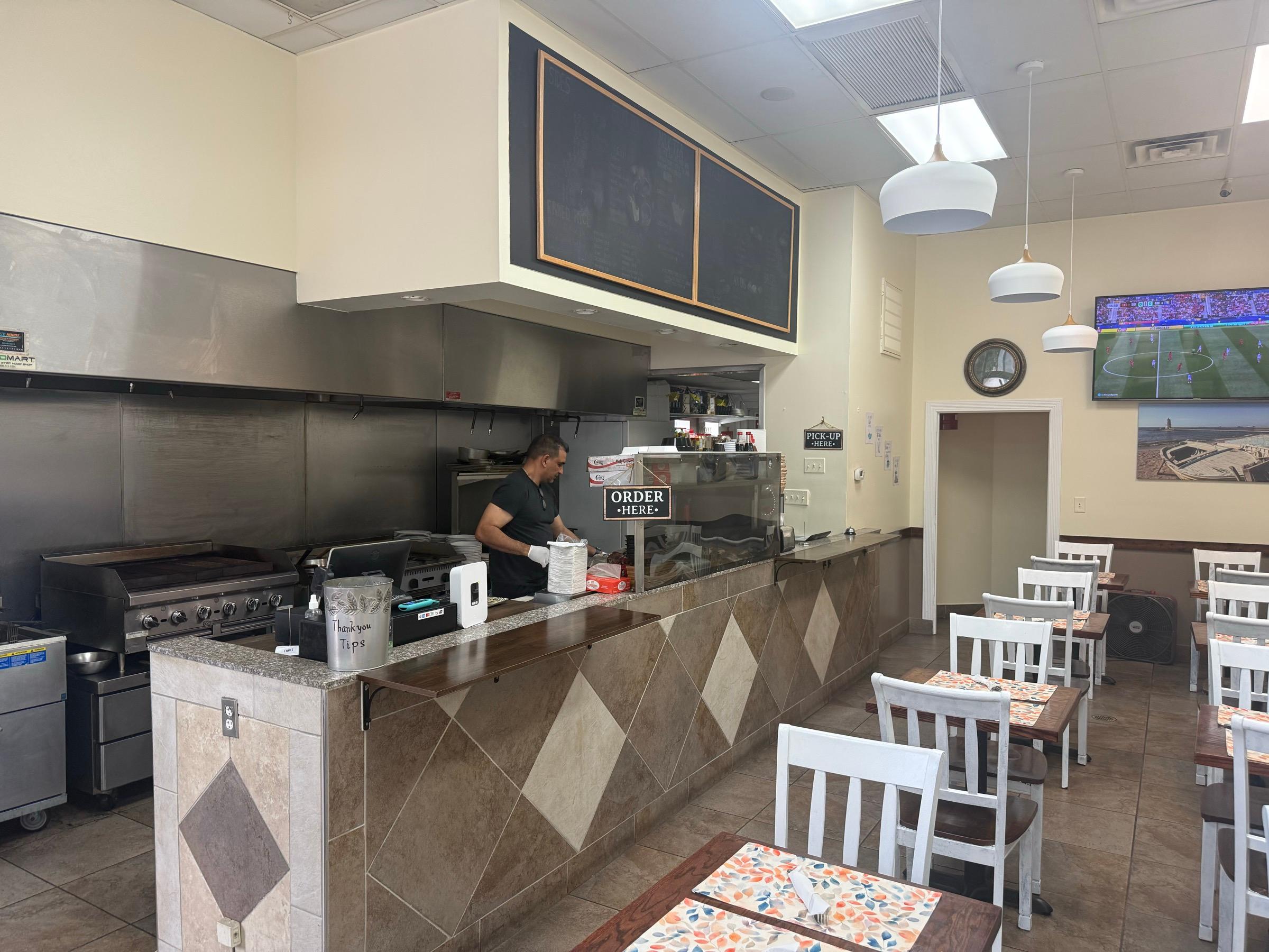 The order counter and open kitchen at Sam's Kitchen